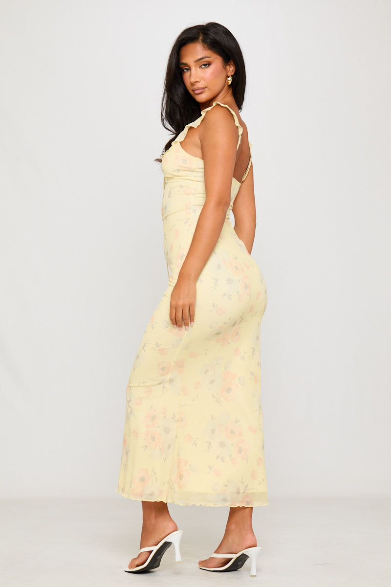 Robe longue à volants et imprimé floral jaune